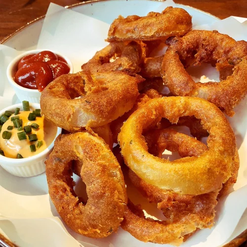 Onion Rings - Golden crispy onion rings — a customer favorite